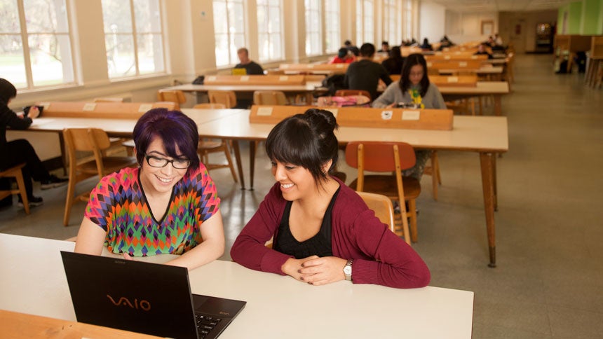 two students study in the ϲʿͼ Shield's Library 24 hour study room