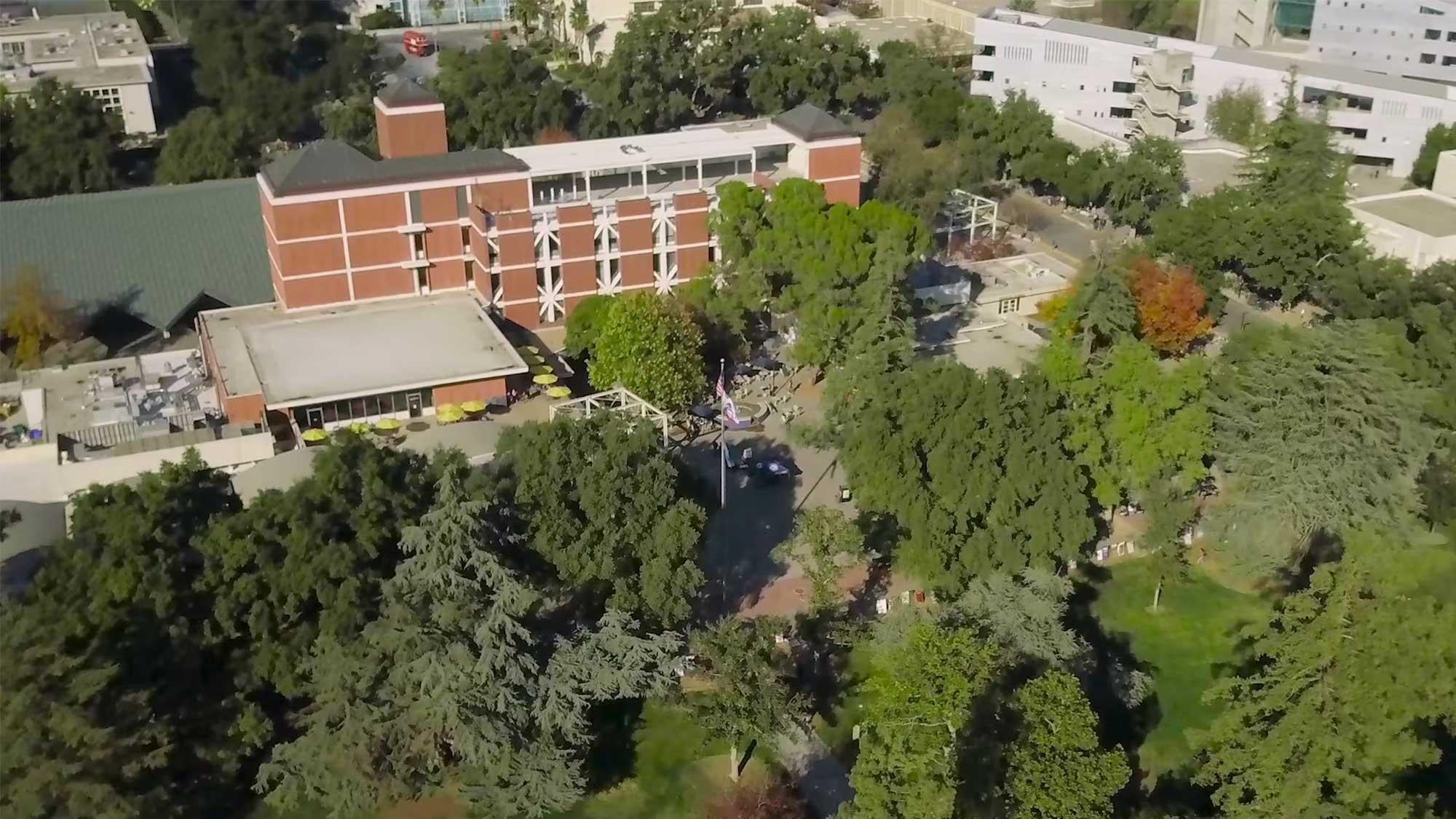 aerial view of the ϲʿͼ campus showing some buildings surrounded by trees