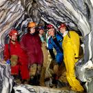 Five ϲʿͼ researchers inside marble rock formations of cave